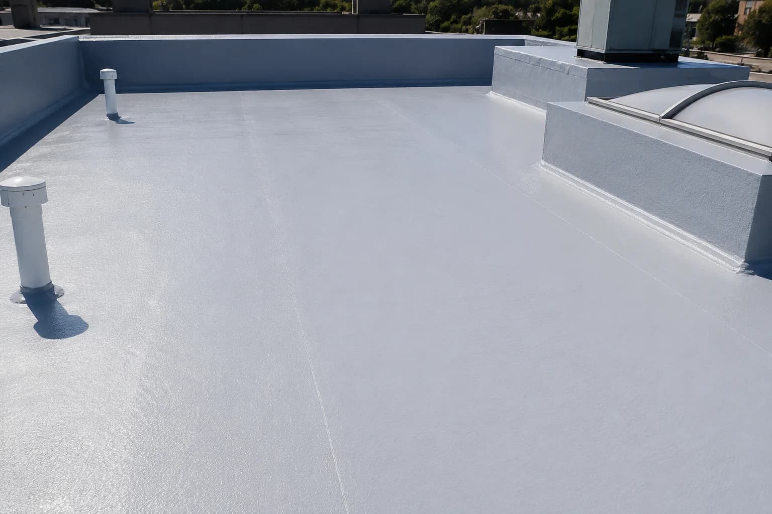 Waterproofing system being applied to a concrete surface